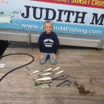 Young boy with nine fish caught on the Judith M charter boat