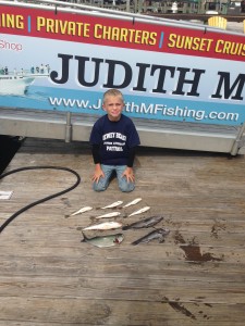 Young boy with nine fish caught on the Judith M charter boat